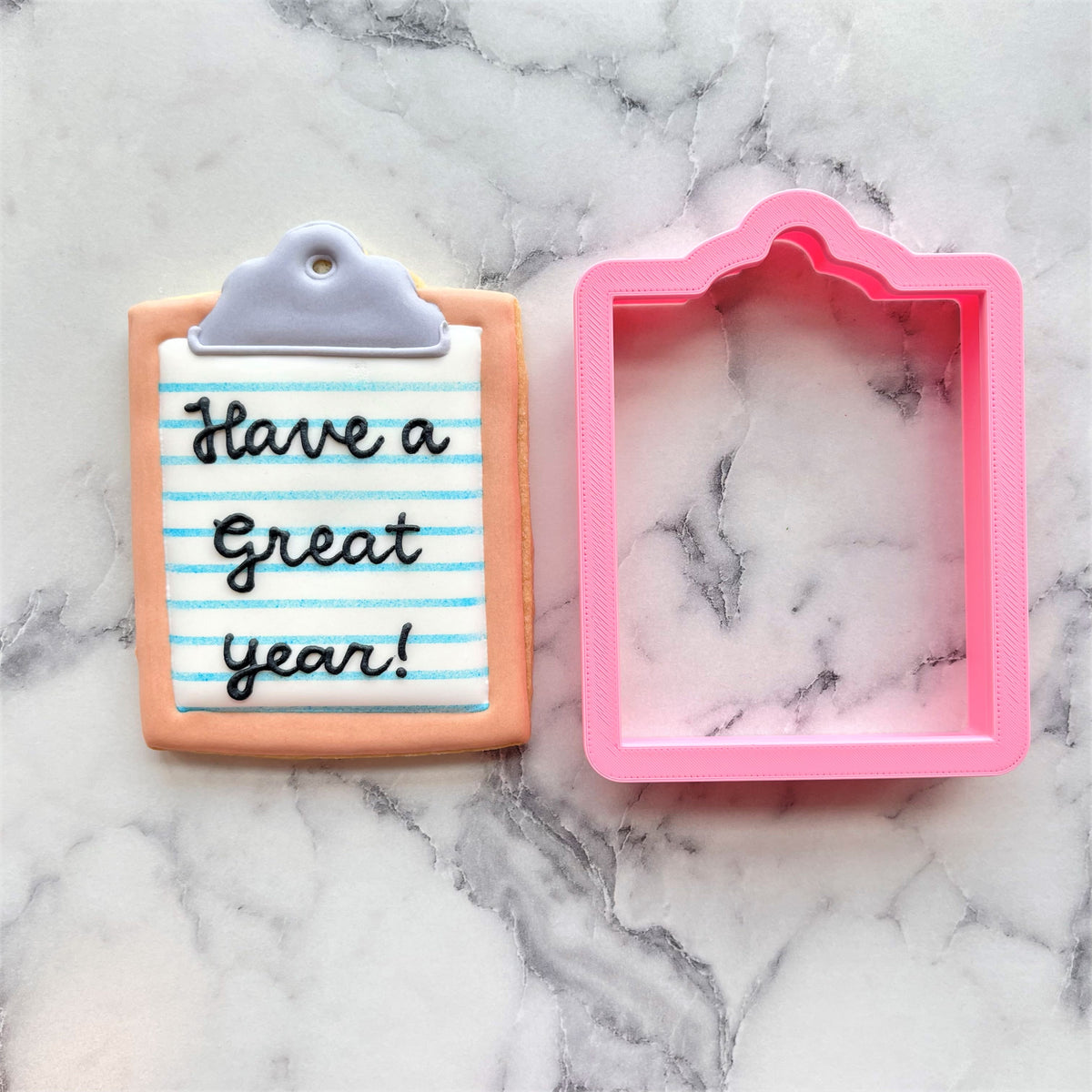 Pink silicone clipboard cookie cutter with marbled interior for baking and crafting use