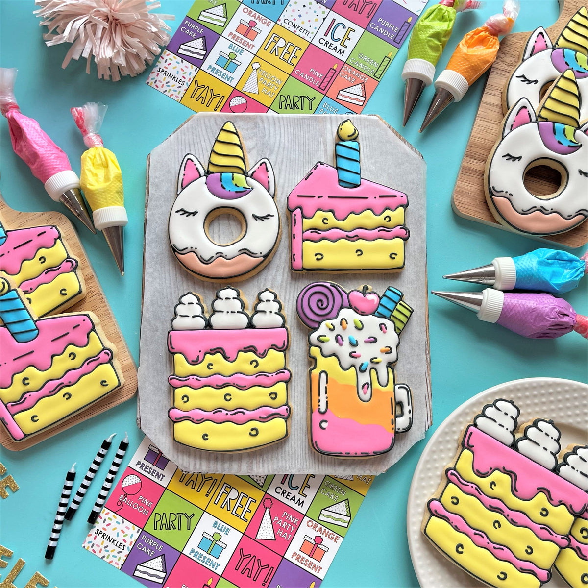 Pastel pink and yellow frosted unicorn donut cookie with rainbow horn and closed eyes for comic cookie decorating class recording