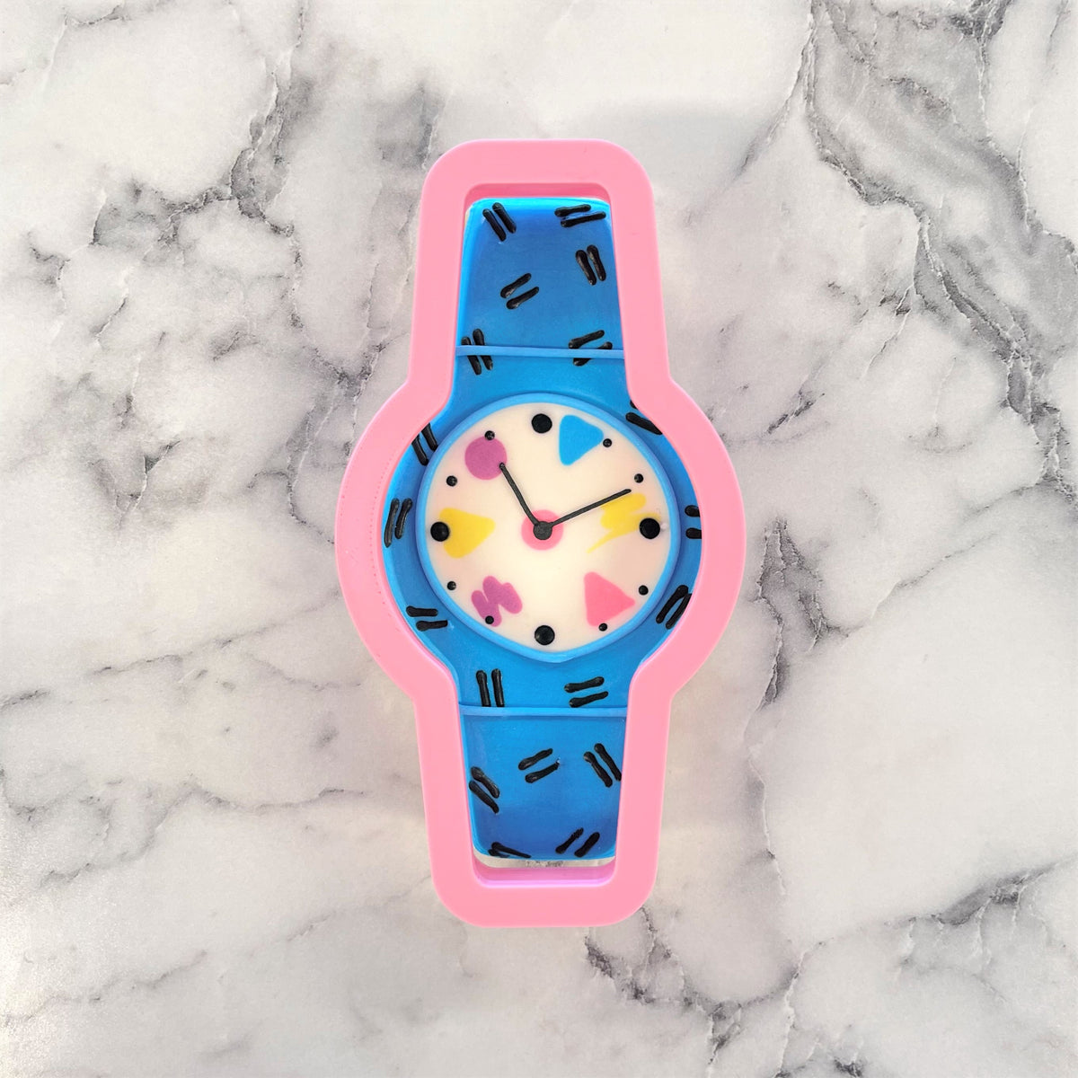 Cool watch cookie cutter children’s watch with pink and blue geometric pattern and playful colorful face with black lines