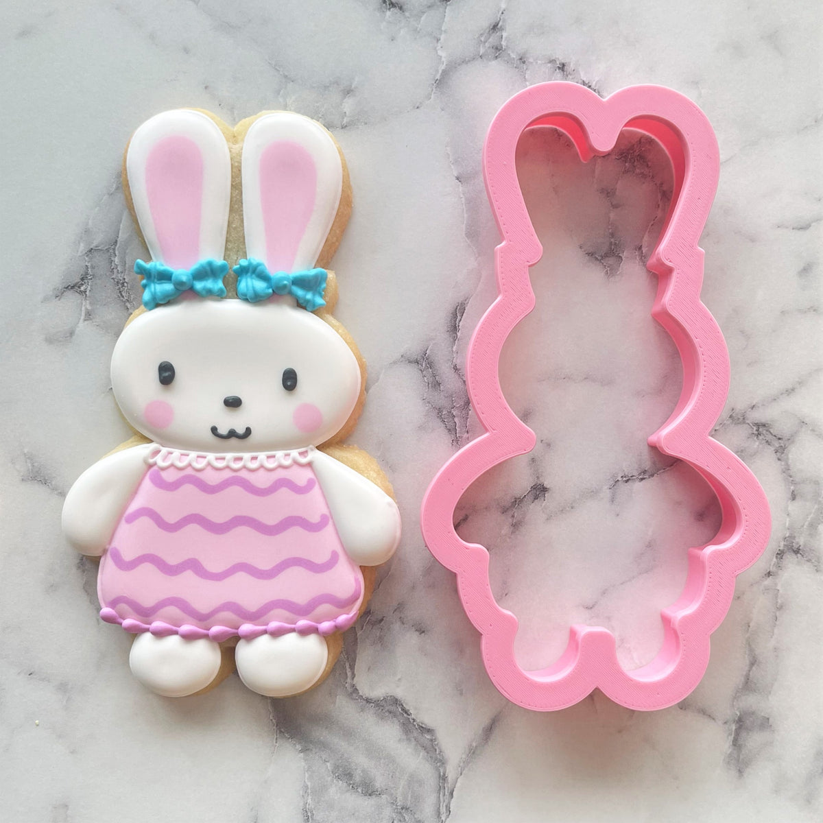 Darling bunny cookie cutter in pink with a smooth glossy finish for creating bunny-shaped cookies
