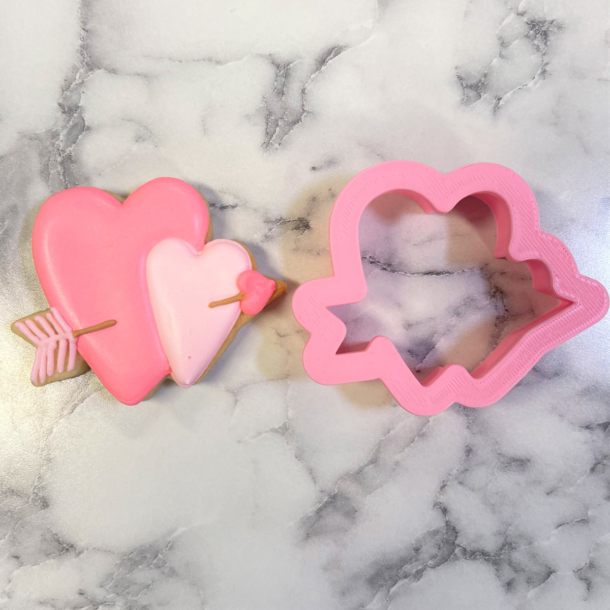 Pink mini double heart with arrow cookie cutter made of metal for baking and crafting purposes