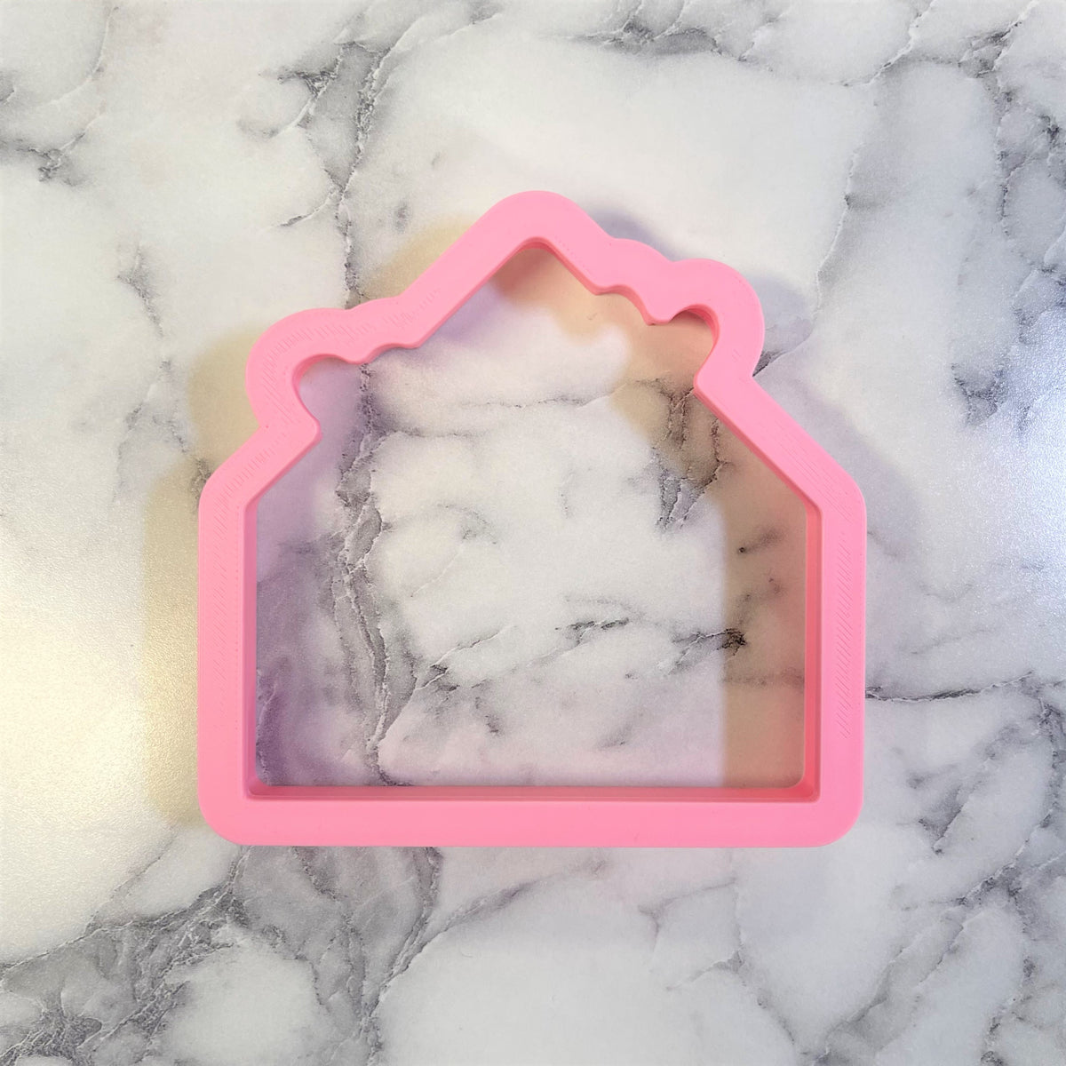 Pink silicone envelope with hearts cookie cutter for baking and crafting uses