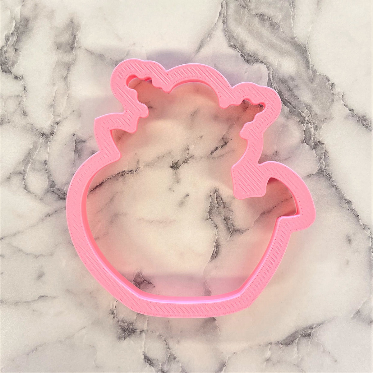 Pink plastic unicorn shaped cookie cutter from floral watering can flour box club for baking and decorating