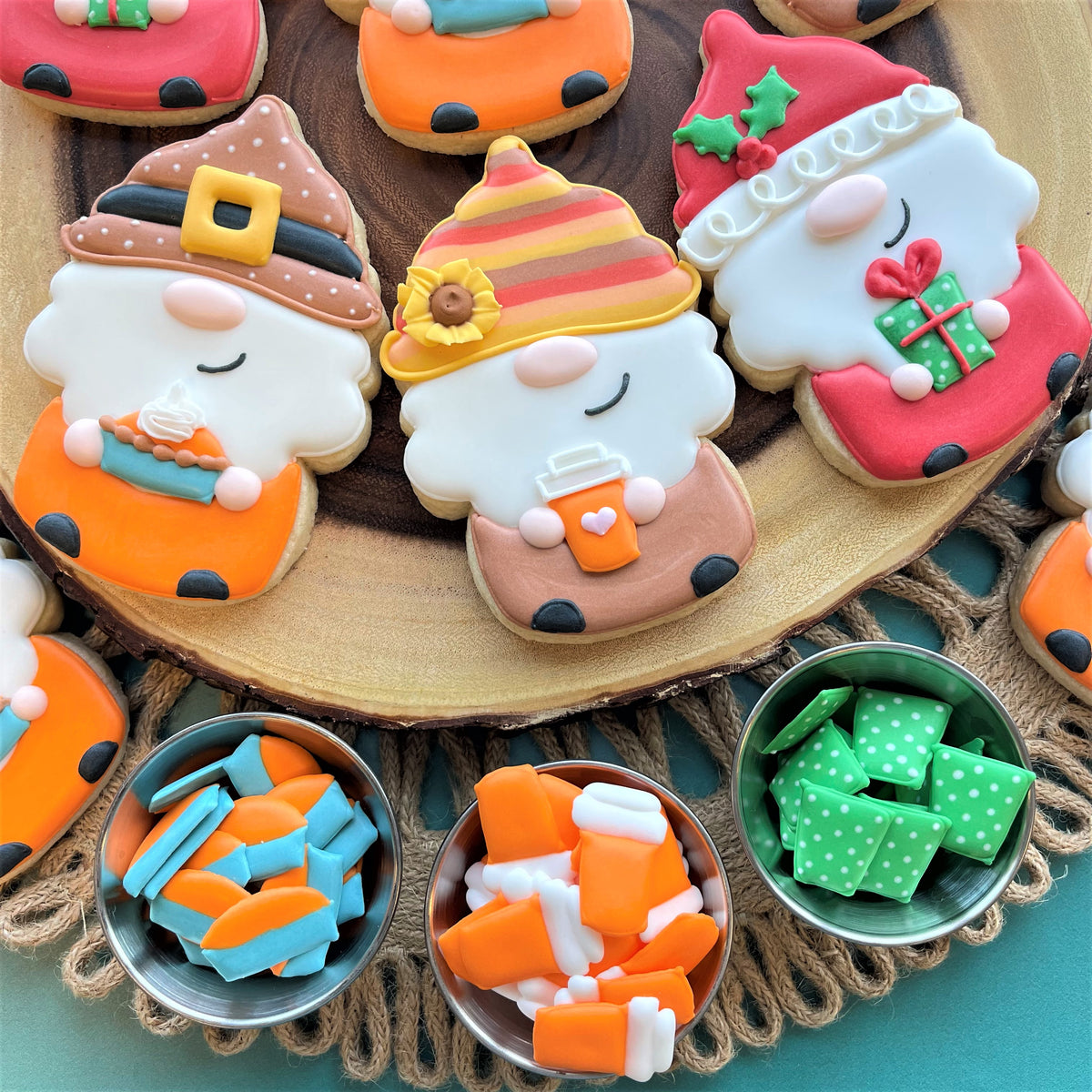 Colorful intricately decorated sugar cookie gnomes with fondant icing made using uncle sam gnome cookie cutter