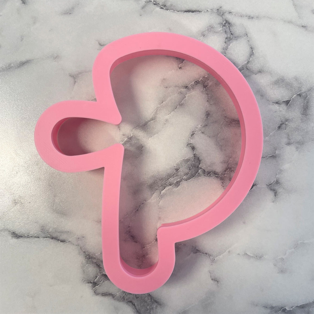Pink silicone hallelujah cross cookie cutter shaped like letter p with heart detail for baking and decorating