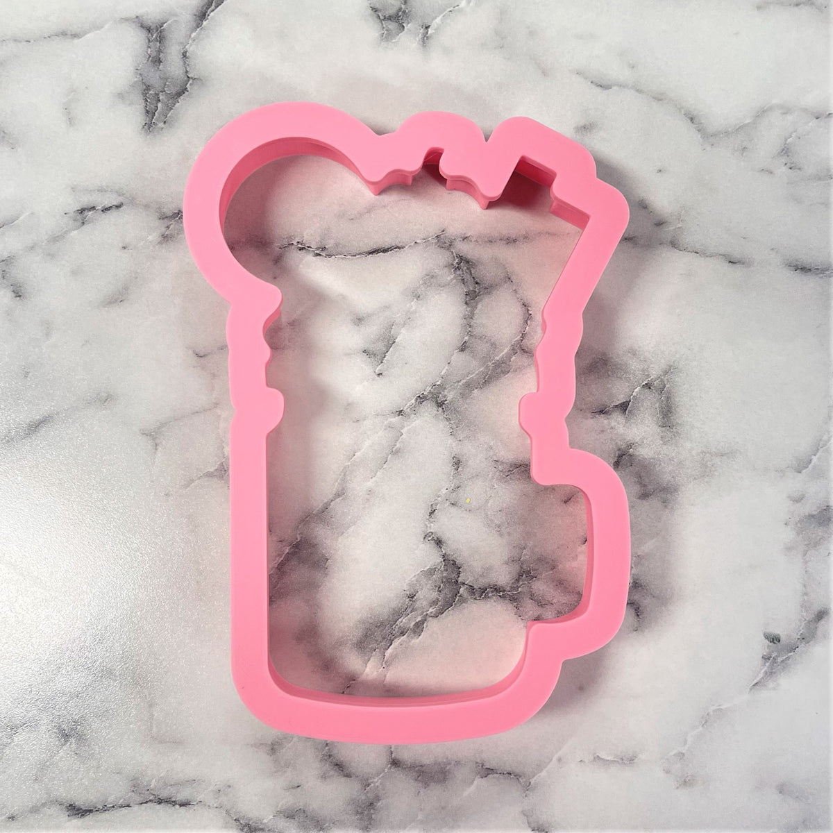 Pink silicone milkshake jar cookie cutter shaped like a toast slice for baking and crafting use