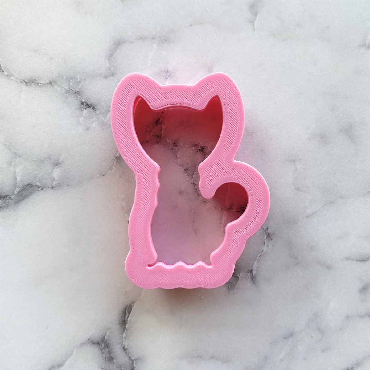Mini classic black cat cookie cutter pink plastic with smooth glossy finish and detailed ears eyes and tail cutouts