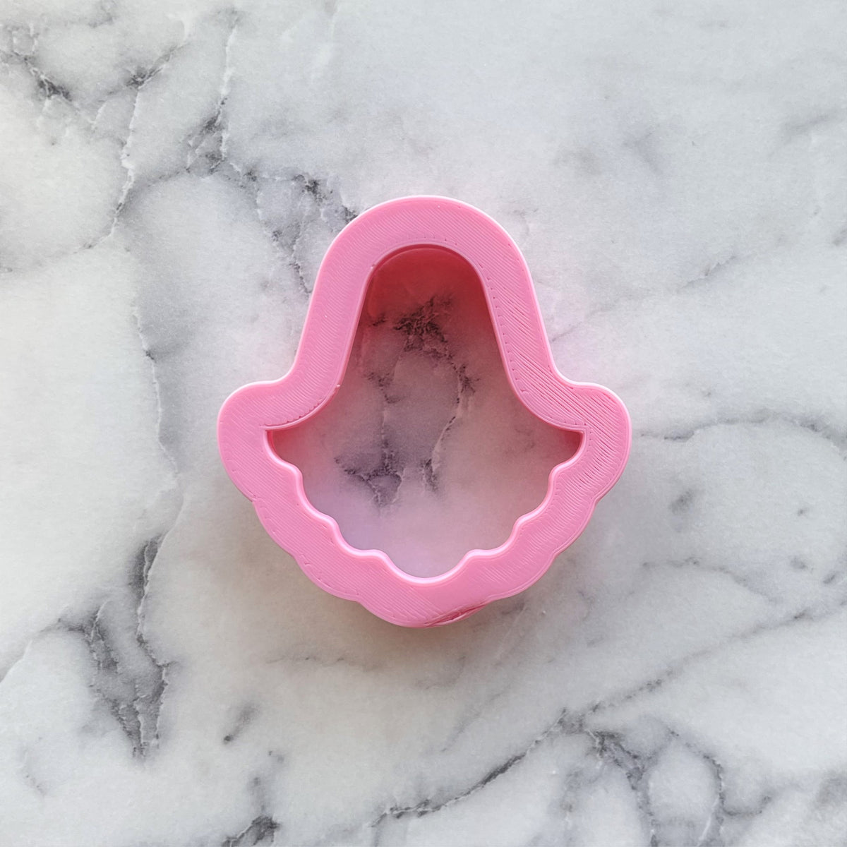 Pink plastic mermaid-shaped cookie cutter shown from the back in a mini classic ghost cookie cutter product image