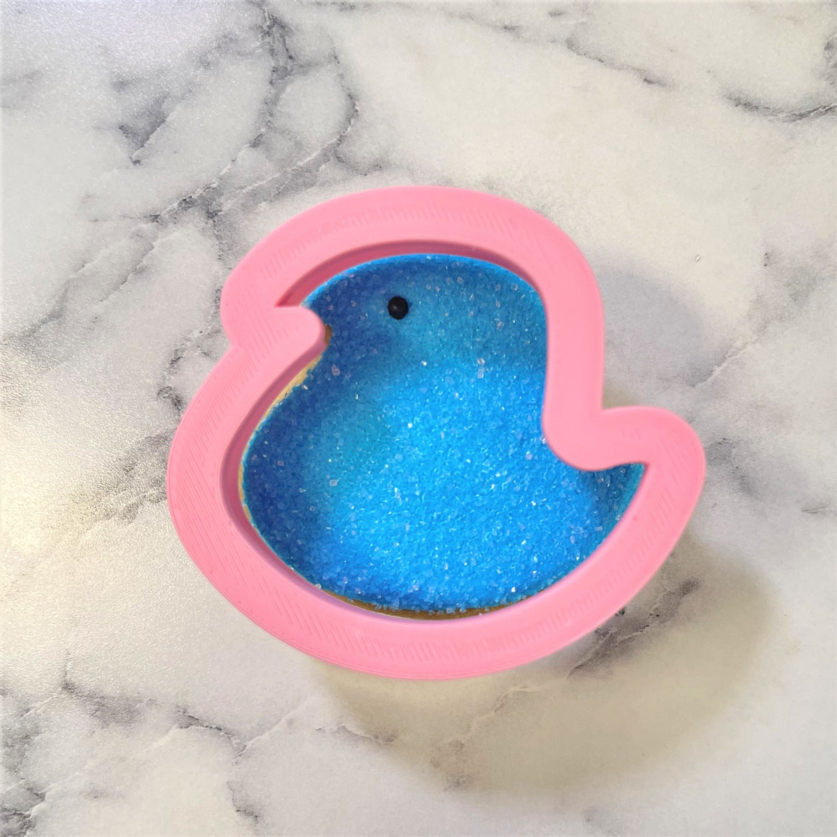 Mini Easter chick cookie cutter pink silicone with blue glittery interior and black dot eye for baking use