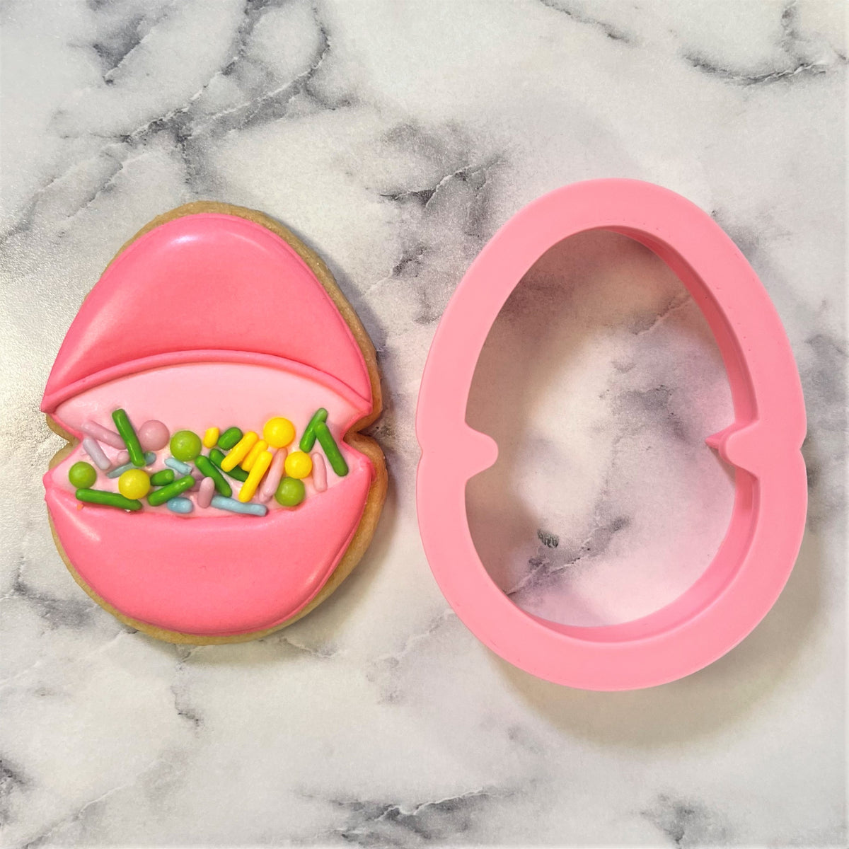 Mini easter egg with candy cookie cutter pink silicone egg shaped cutter with decorated sugar cookie and sprinkles