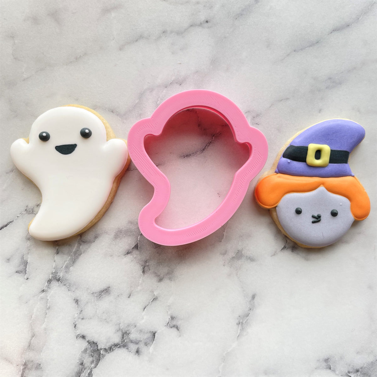 Mini ghost cookie flip cutter in pink plastic for baking ghost shaped cookies and treats