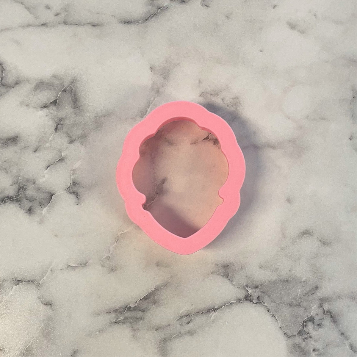 Mini spa girl cookie cutter pink silicone with scalloped edges and hollow face shape for baking and crafts