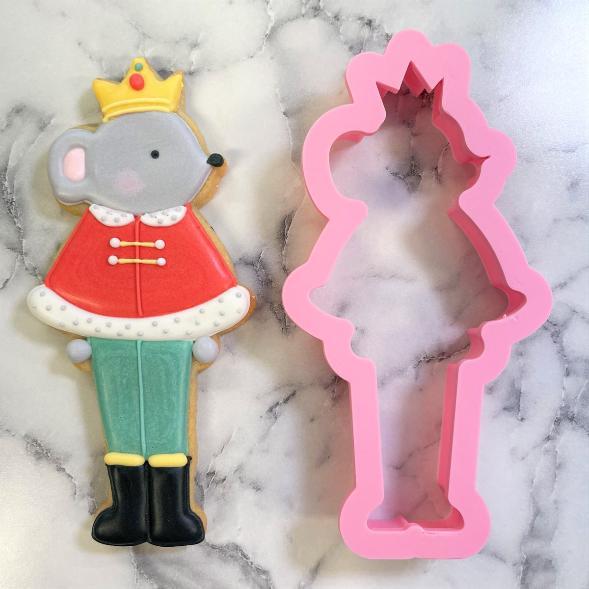 Pink silicone nutcracker soldier cookie cutter shaped like mouse king for baking and decorating cookies
