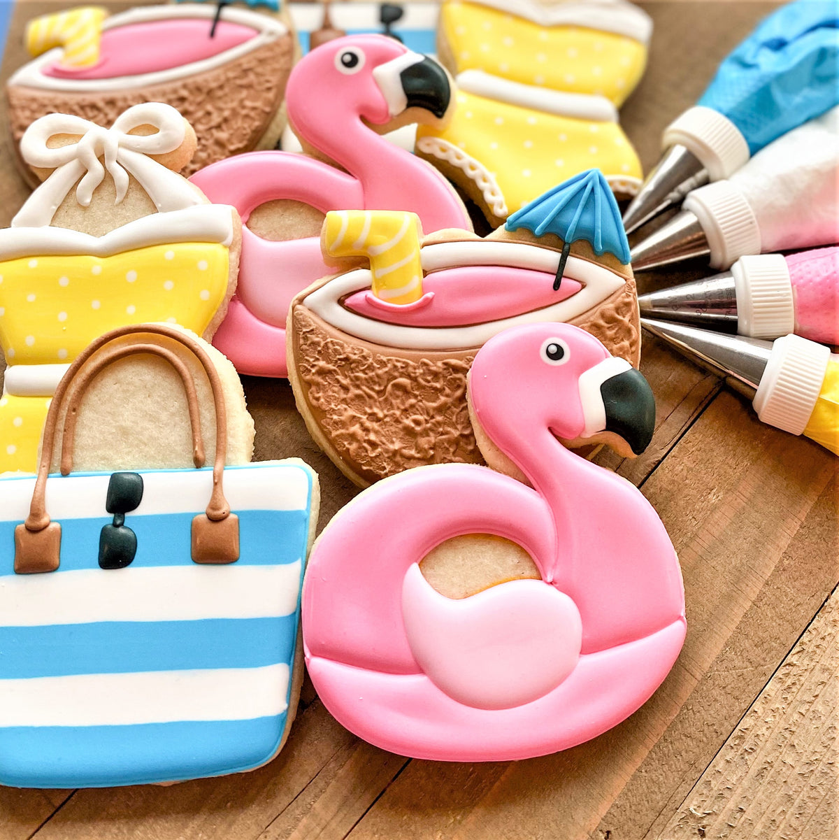 Pink flamingo-shaped cookie with smooth icing and black beak detail made using flamingo floaty cookie cutter