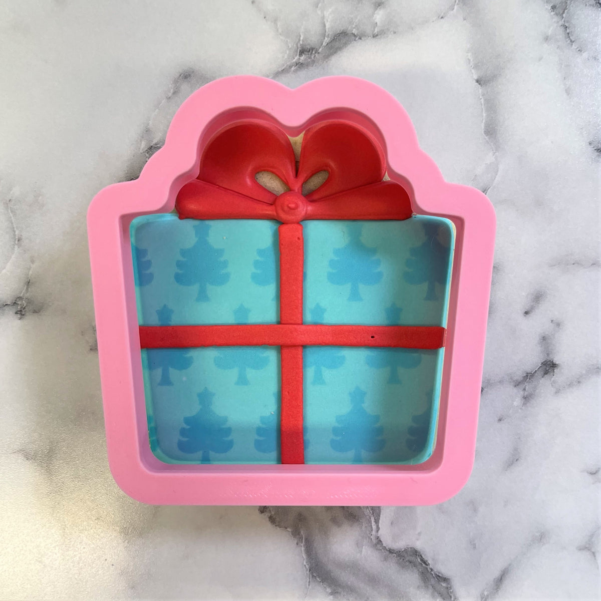 Classic present cookie cutter pink silicone gift box mold with red ribbon and light blue tree pattern interior