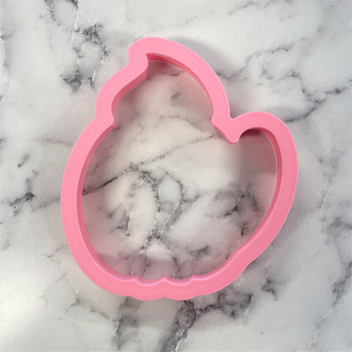 Pink silicone pumpkin latte cookie cutter shaped like a pumpkin for fall baking and decorating