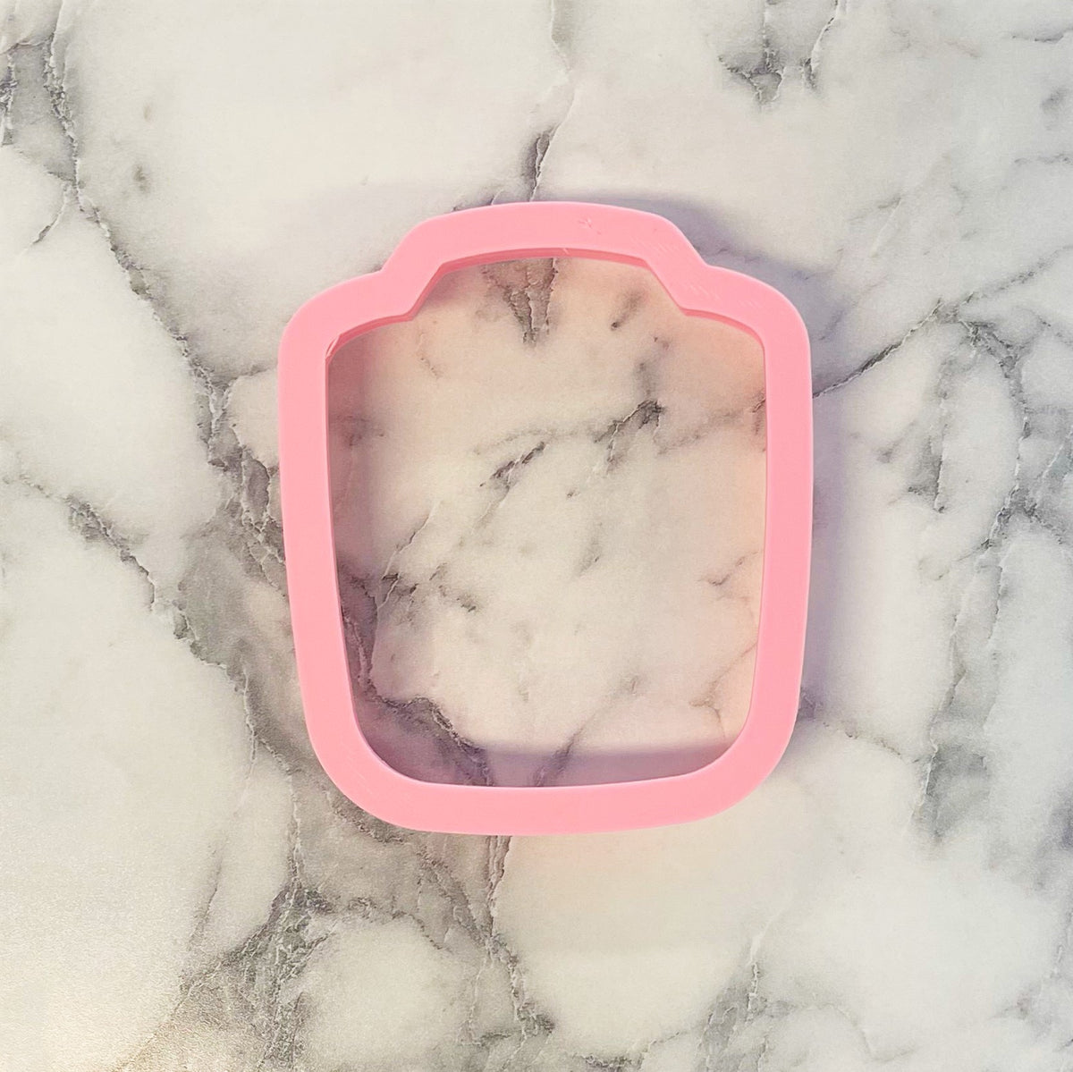 Pink silicone robe cookie cutter shaped like a toaster for baking and crafting use