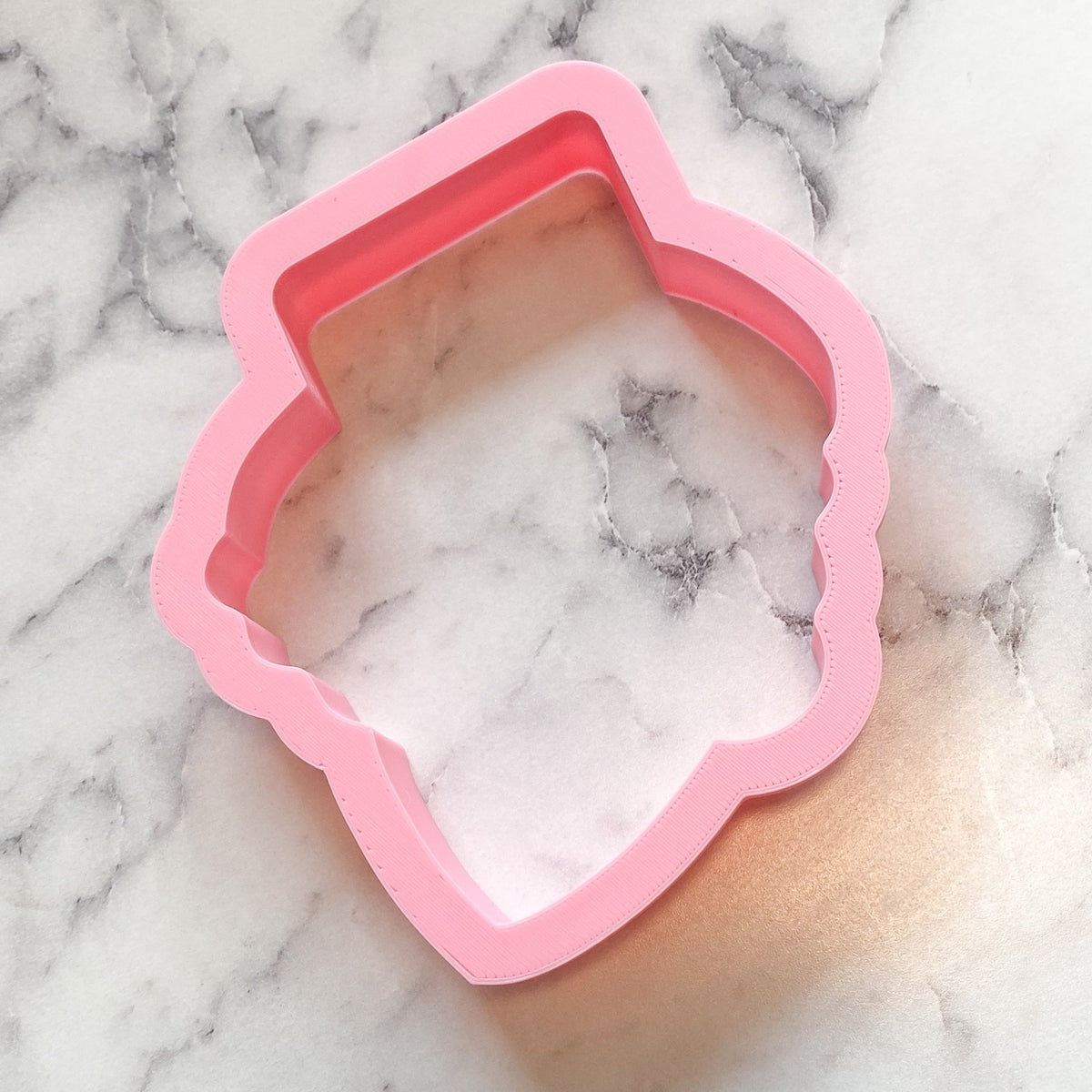 Pink silicone cookie cutter shaped like a teapot from scarecrow boy face cookie cutter product collection