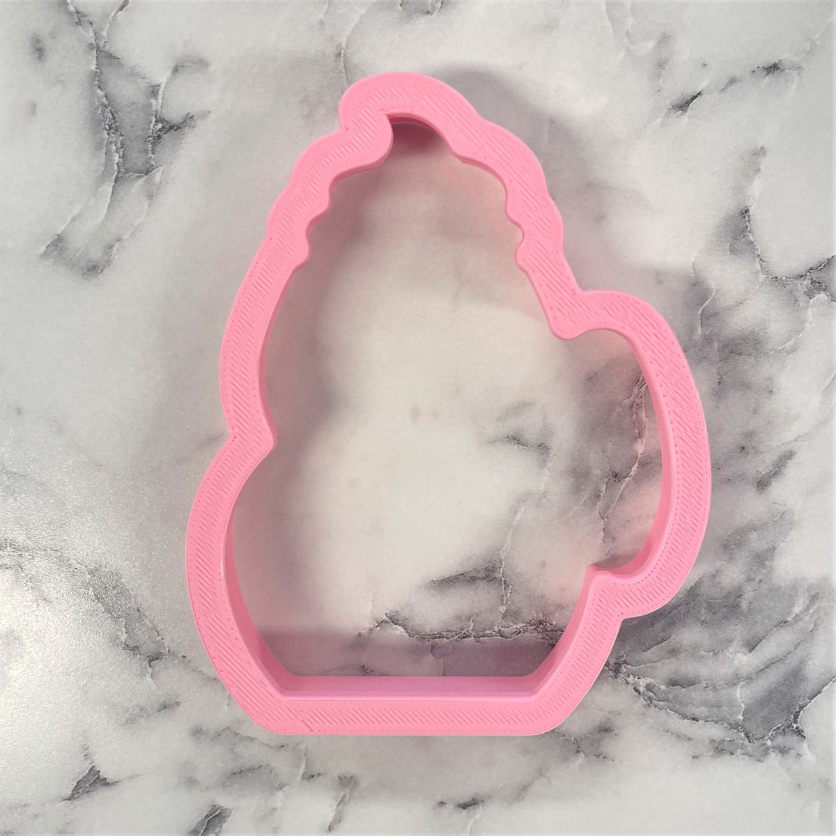 Pink plastic unicorn-shaped cookie cutter from snowman mug flour box club for baking and decorating