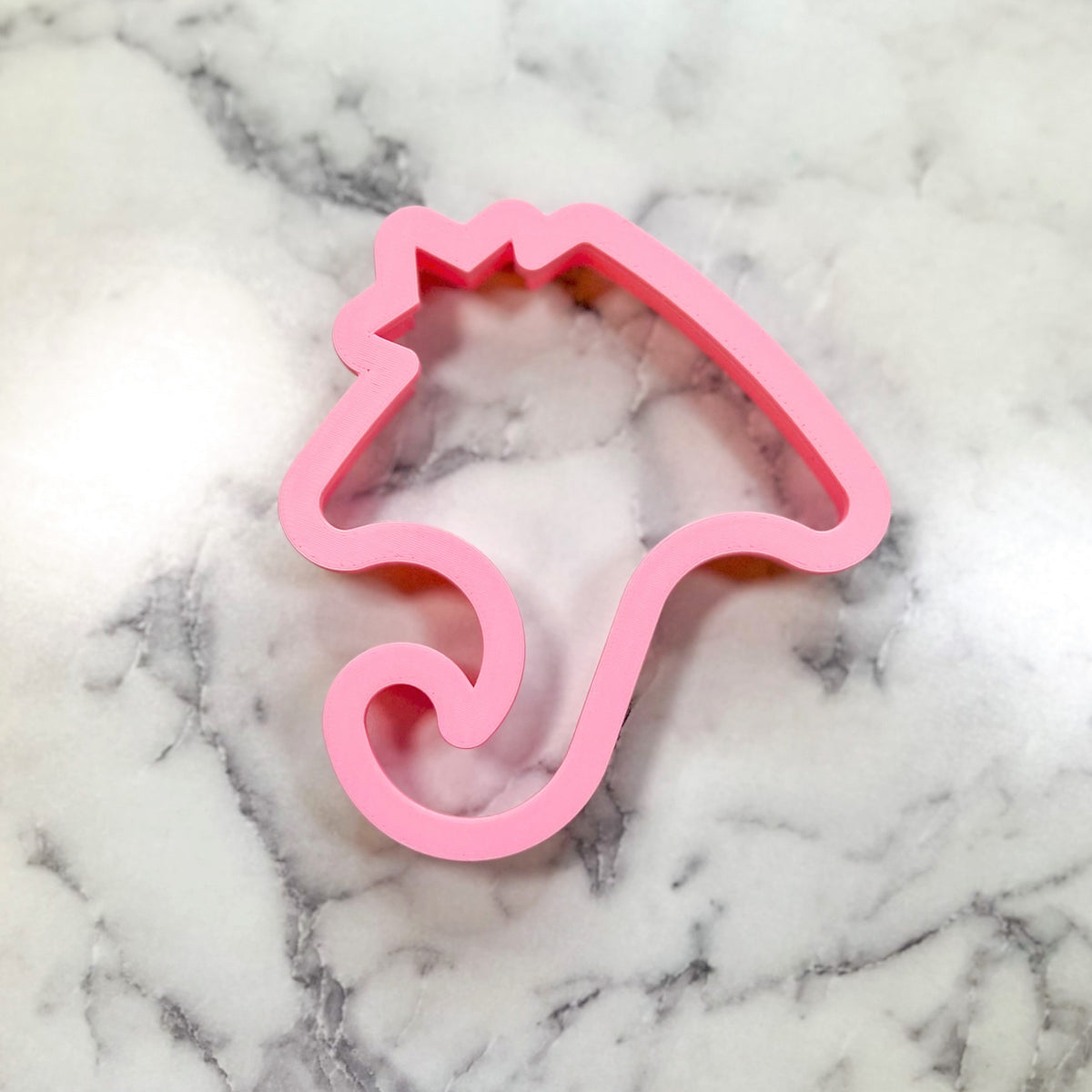 Pink plastic unicorn cookie cutter from stingray flour box club for creative baking and themed cookies