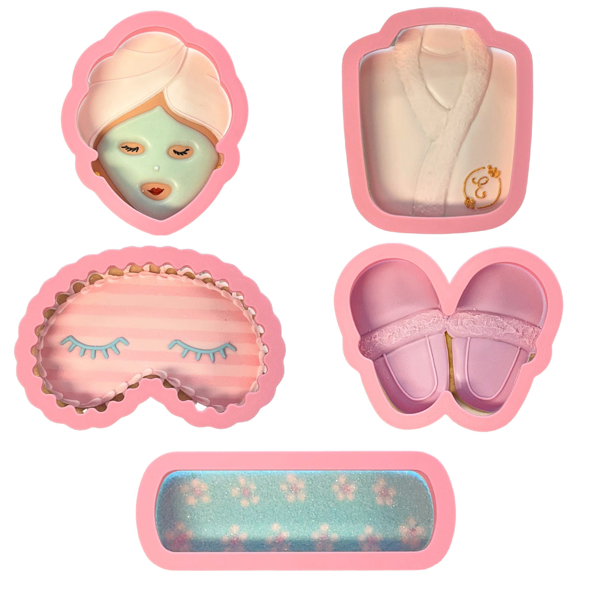 Pink silicone spa cookie cutter bundle featuring bath time-themed molds including face mask robe eye pillow slippers and bolster