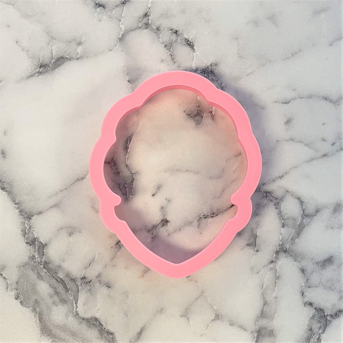 Pink silicone spa girl cookie cutter with scalloped edges for baking and crafting use