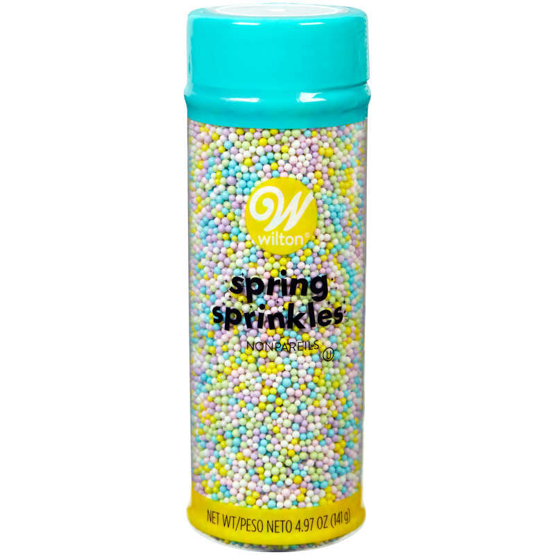 A clear cylindrical container with a turquoise lid and yellow base filled with pastel spring nonpareils sprinkles