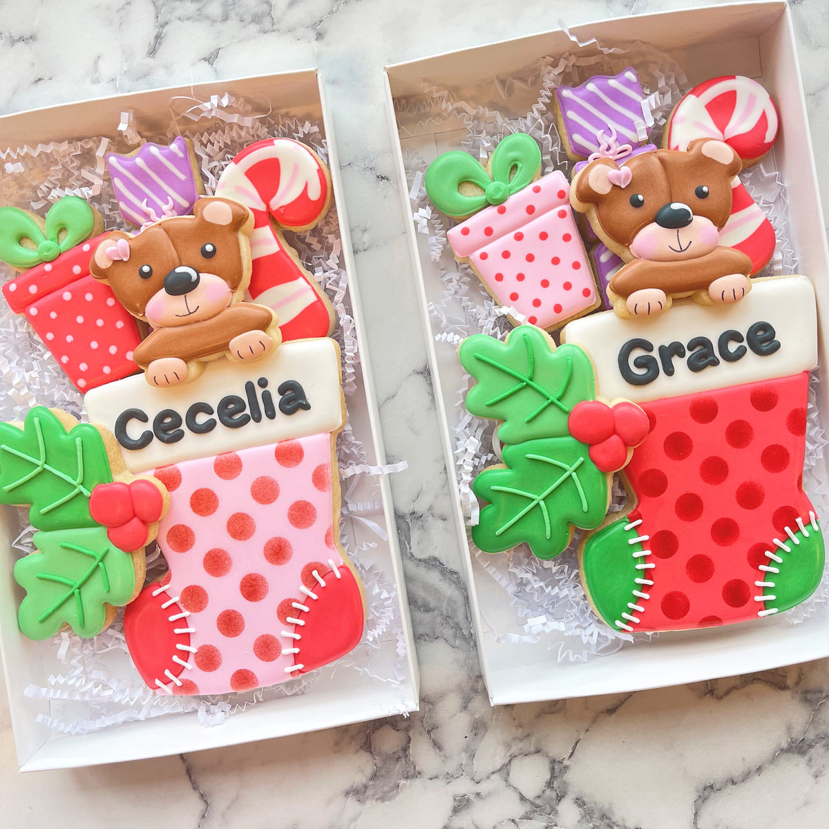 A festive red and pink polka-dotted christmas stocking cookie decorated with green holly and a brown bear figurine using candy cane rounded cookie cutter