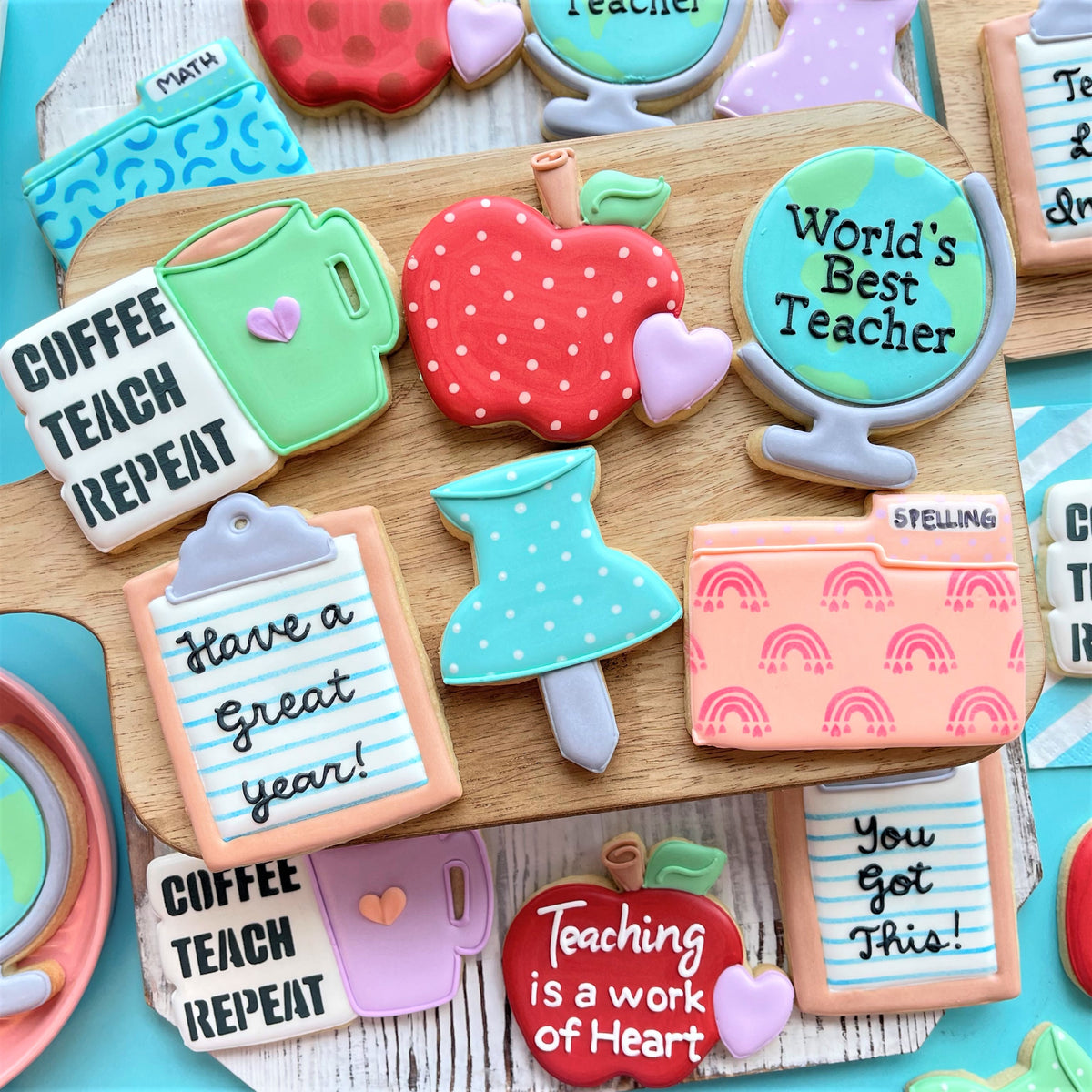 Red apple shaped cookie with white polka dots and green leafy top made using folder cookie cutter