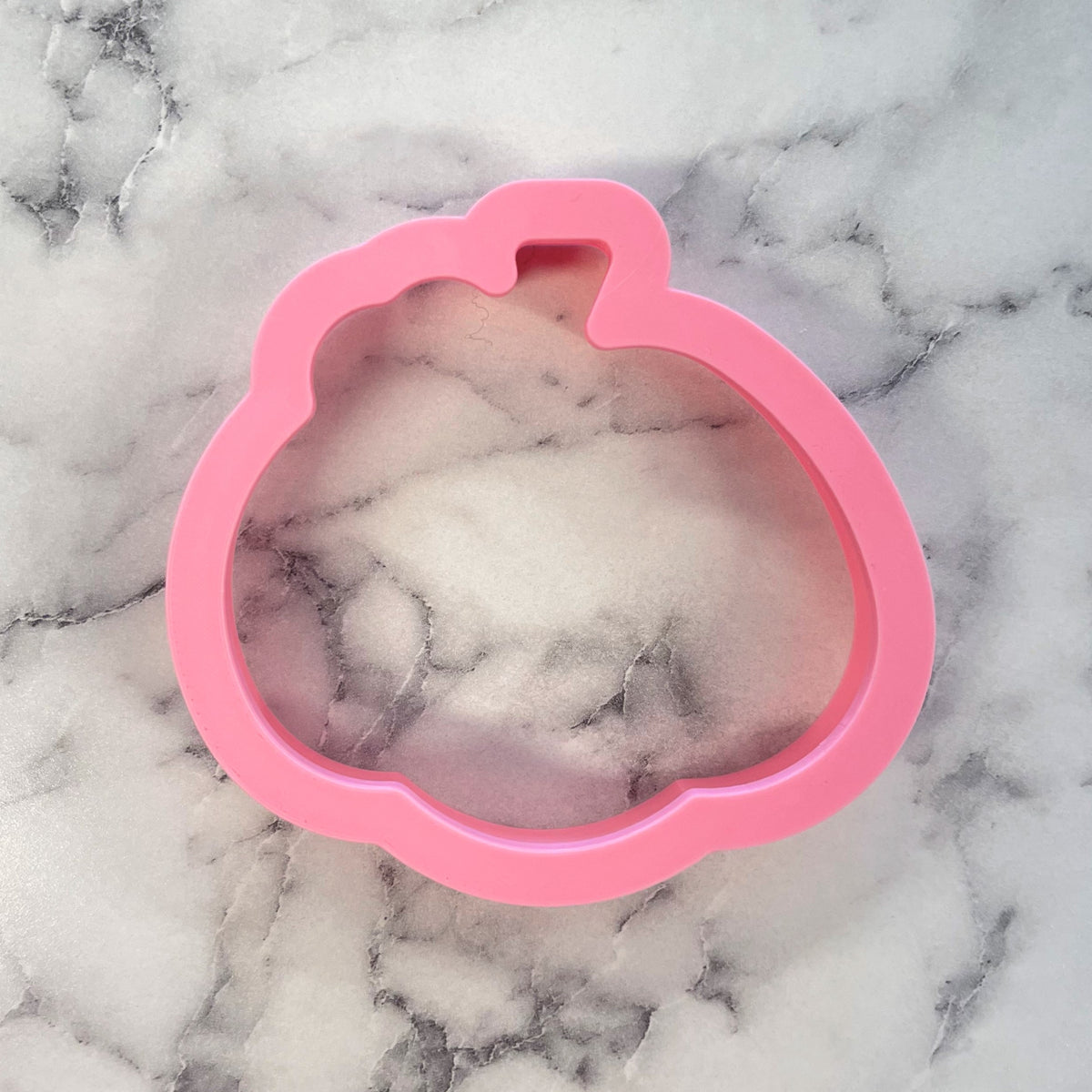 Pink silicone Thanksgiving pumpkin cookie cutter shaped for festive baking and decorating use