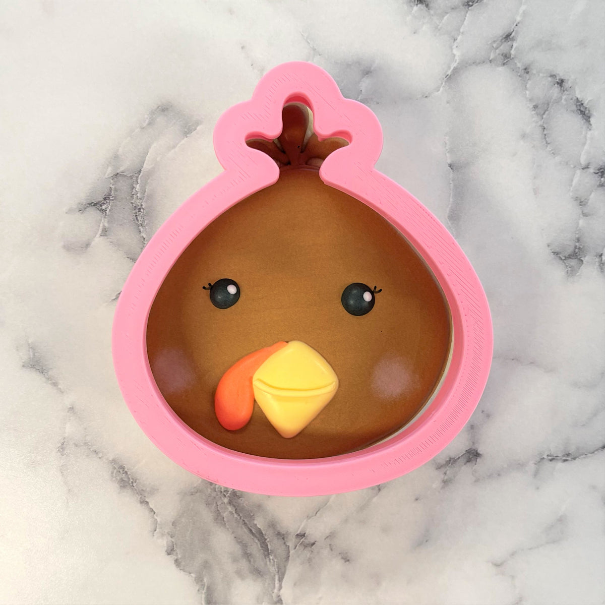 Thanksgiving turkey cookie cutter pink plastic with brown interior black eyes orange wattle and yellow beak