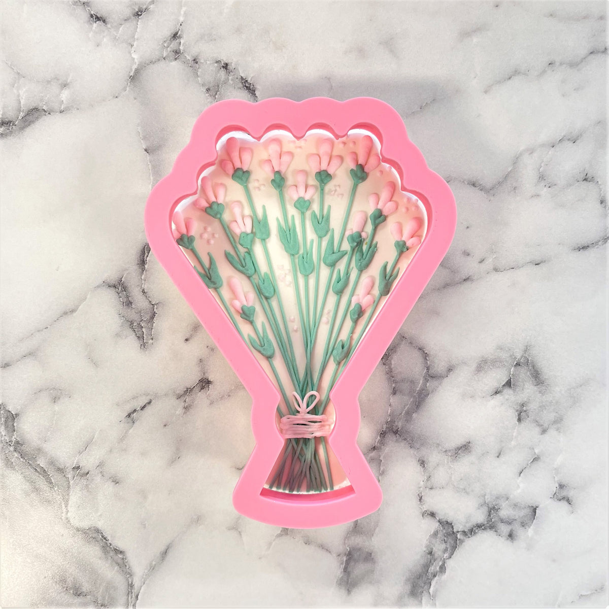 Pink silicone wedding bouquet cookie cutter shaped like lavender flowers for baking and decorating cookies