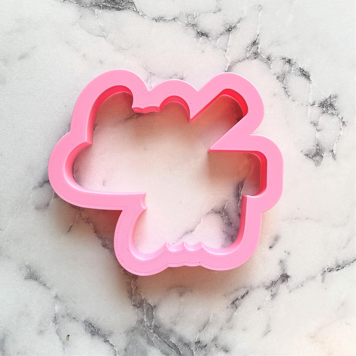 Pink plastic cloud shaped cookie cutter with scalloped edges for best school year ever plaque cookies