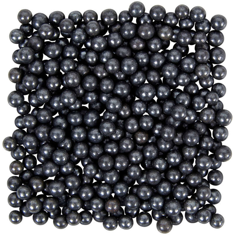 Black glossy spherical beads of black sugar pearl sprinkles for decorating desserts and beverages