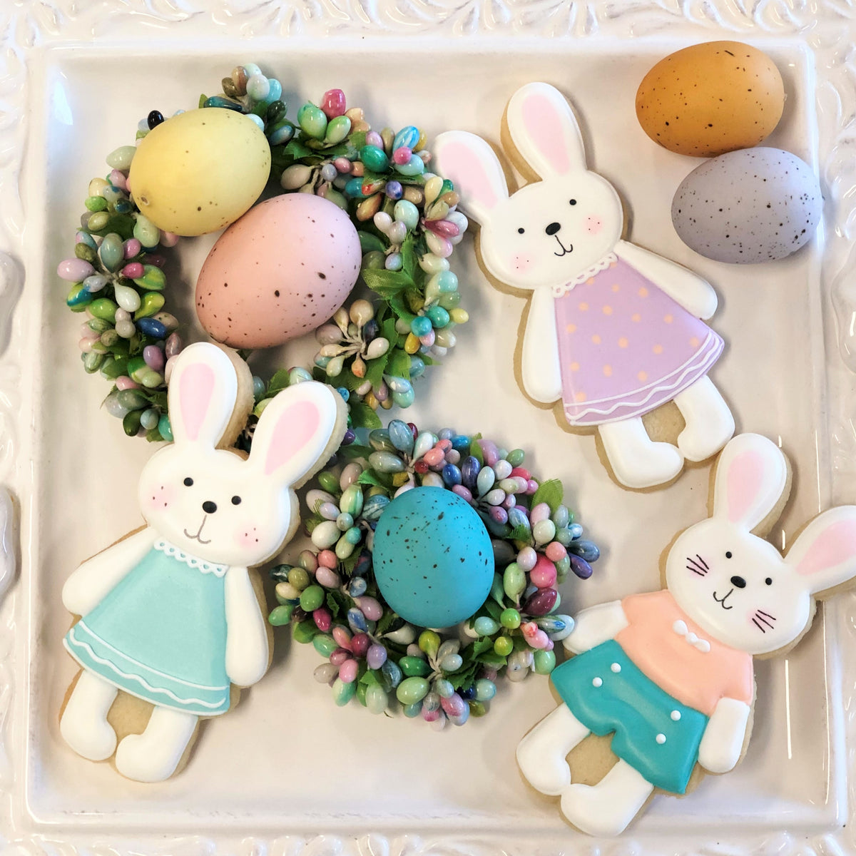 Pastel-colored bunny-shaped sugar cookies with delicate icing made using a standing bunny cookie cutter
