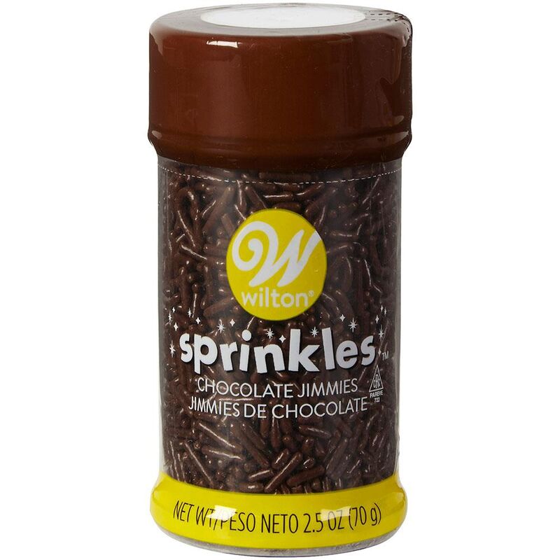 A container of wilton chocolate jimmie sprinkle chocolate sprinkles with a brown lid and yellow label showing stick-shaped candies