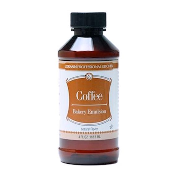 A dark amber glass bottle with black cap labeled coffee bakery emulsion by lorann professional kitchen 4 oz