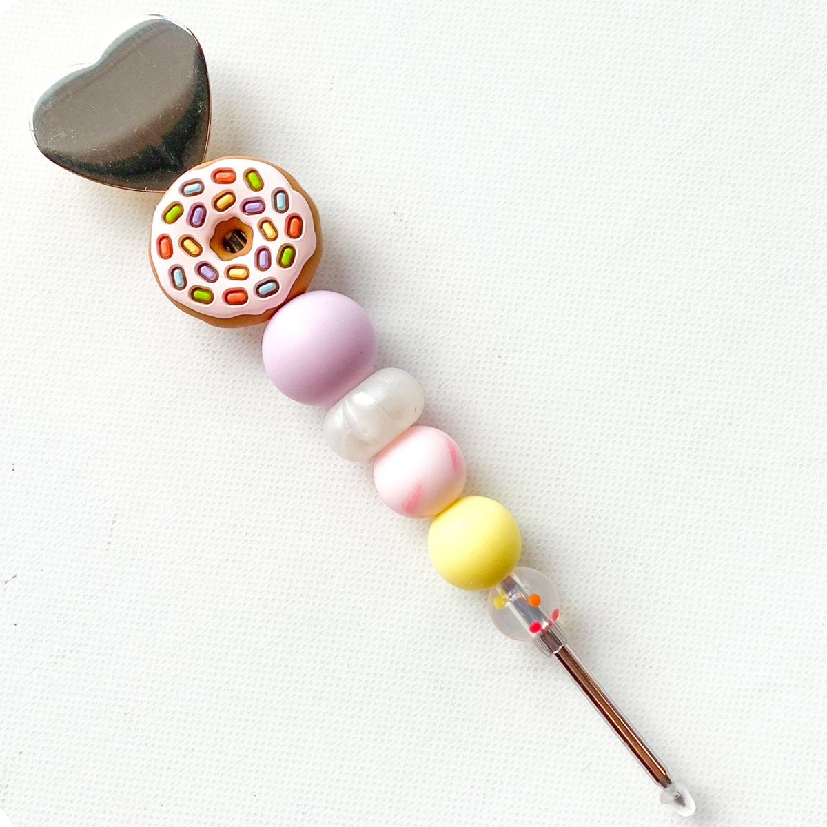 Donut worry be happy cookie scribe pastel crochet hook with heart shaped metallic cap and colorful sprinkle details
