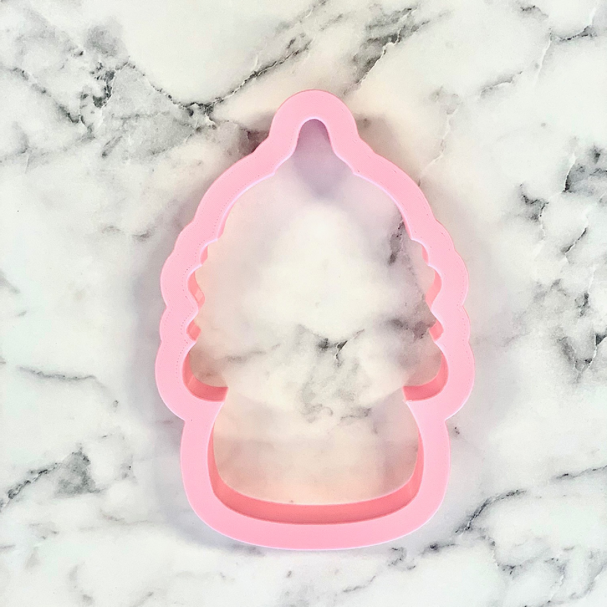 Pink silicone cookie cutter shaped like a tree from uncle sam gnome collection for festive baking