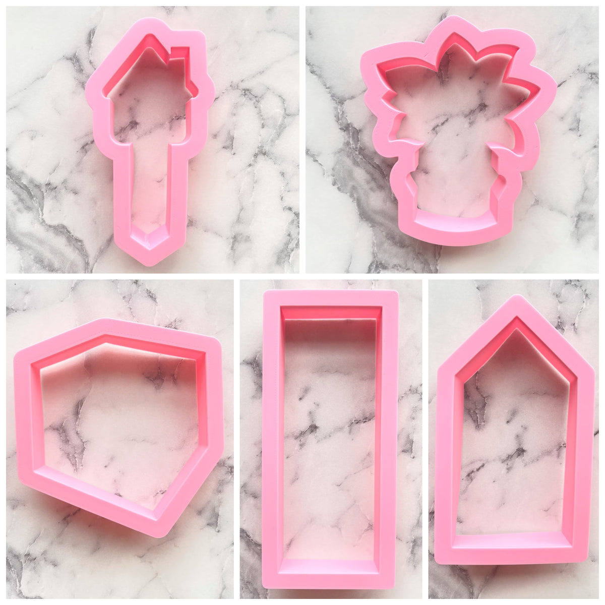 Pink silicone housewarming cookie cutter set with various shapes including house flower and geometric forms