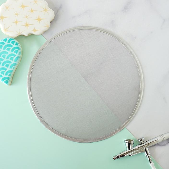Magic stencil screen circular metal mesh screen with silver frame and fine evenly spaced grid pattern