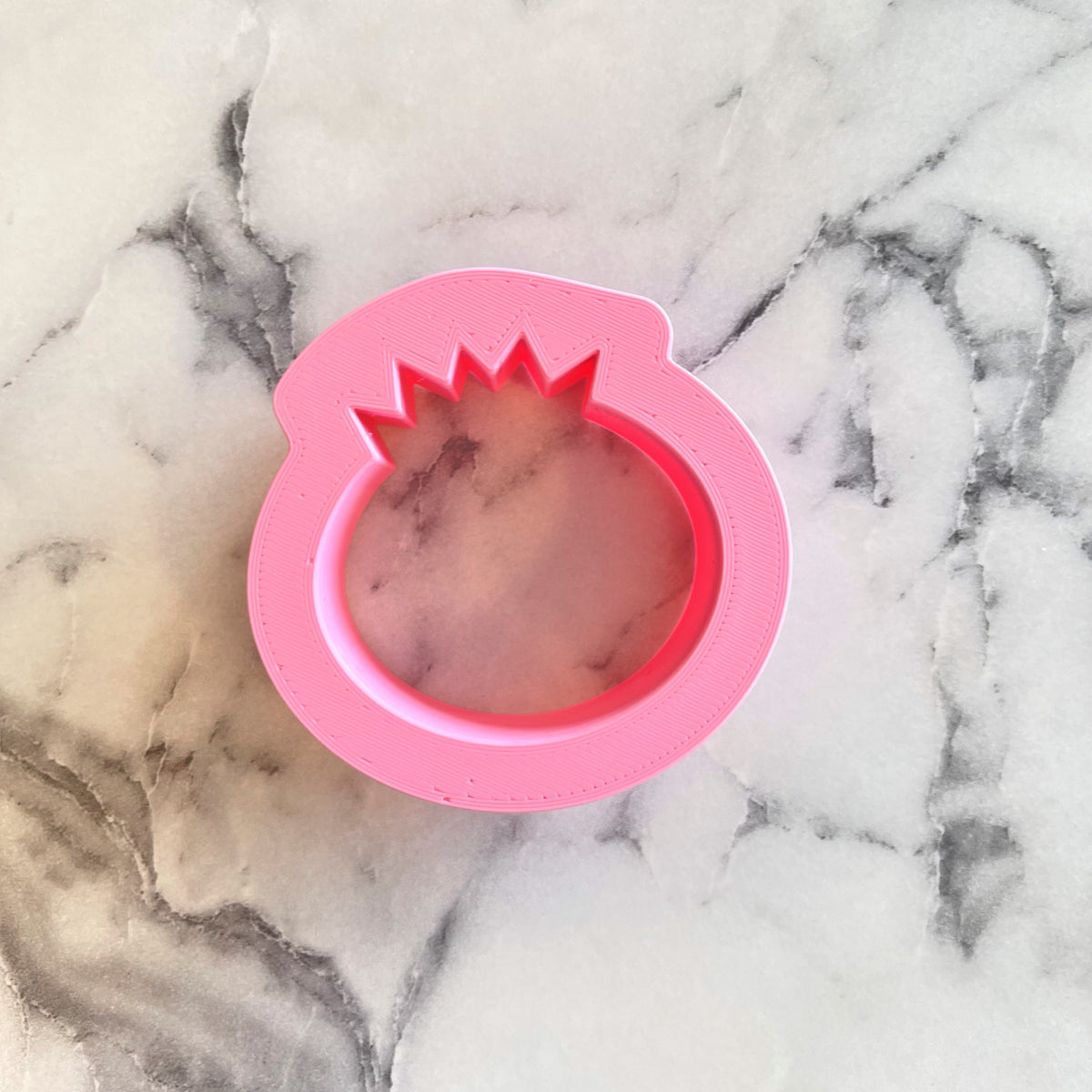 Pink silicone pineapple-shaped mold from the pancake with blueberry cookie cutter set for baking and cooking
