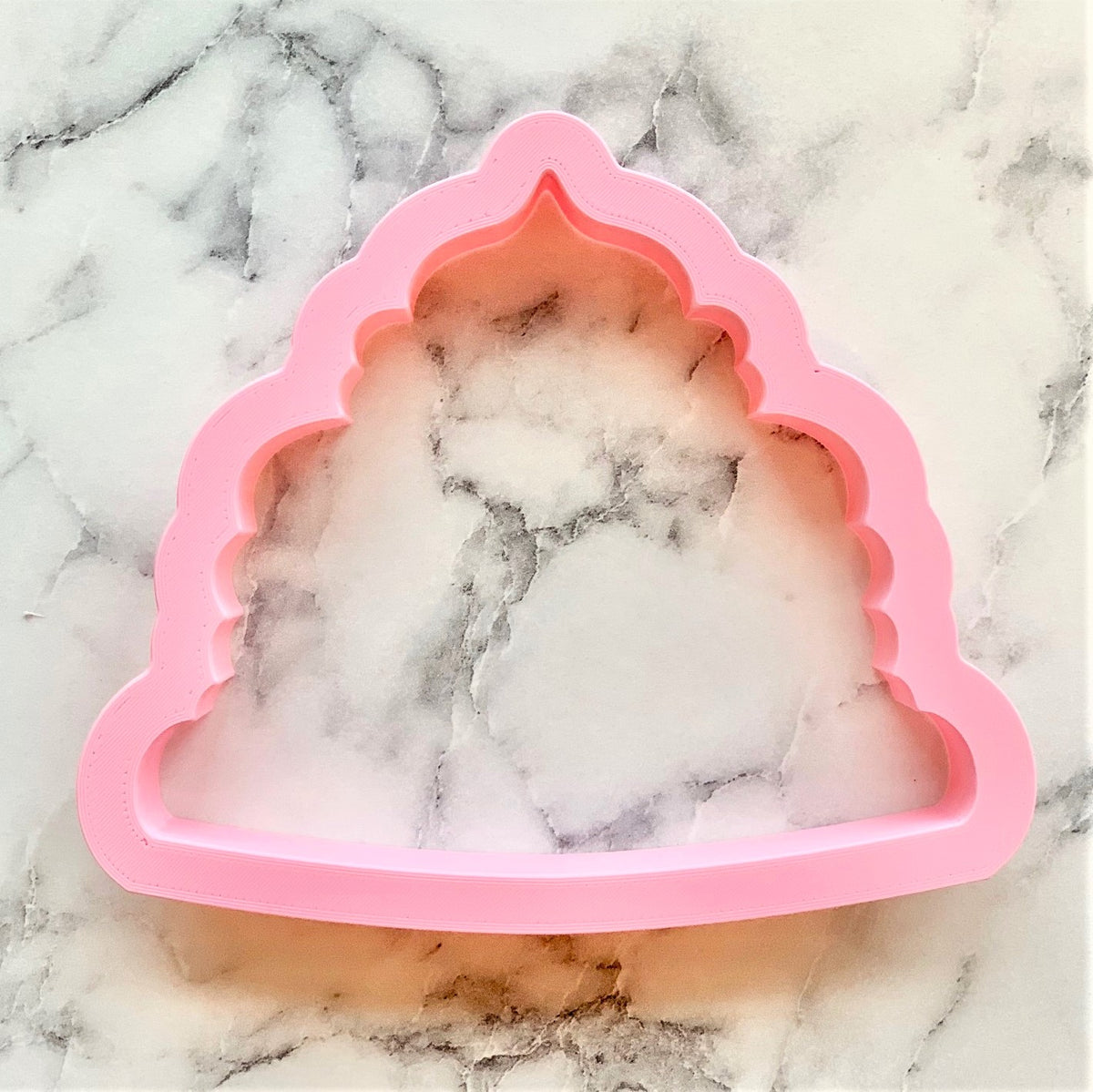 Pink silicone pancake mold shaped like a mosque with intricate arches from blueberry cookie cutter set