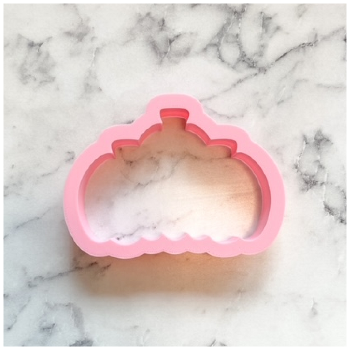 Pink silicone pumpkin cluster cookie cutter for baking festive fall-themed treats and cookies