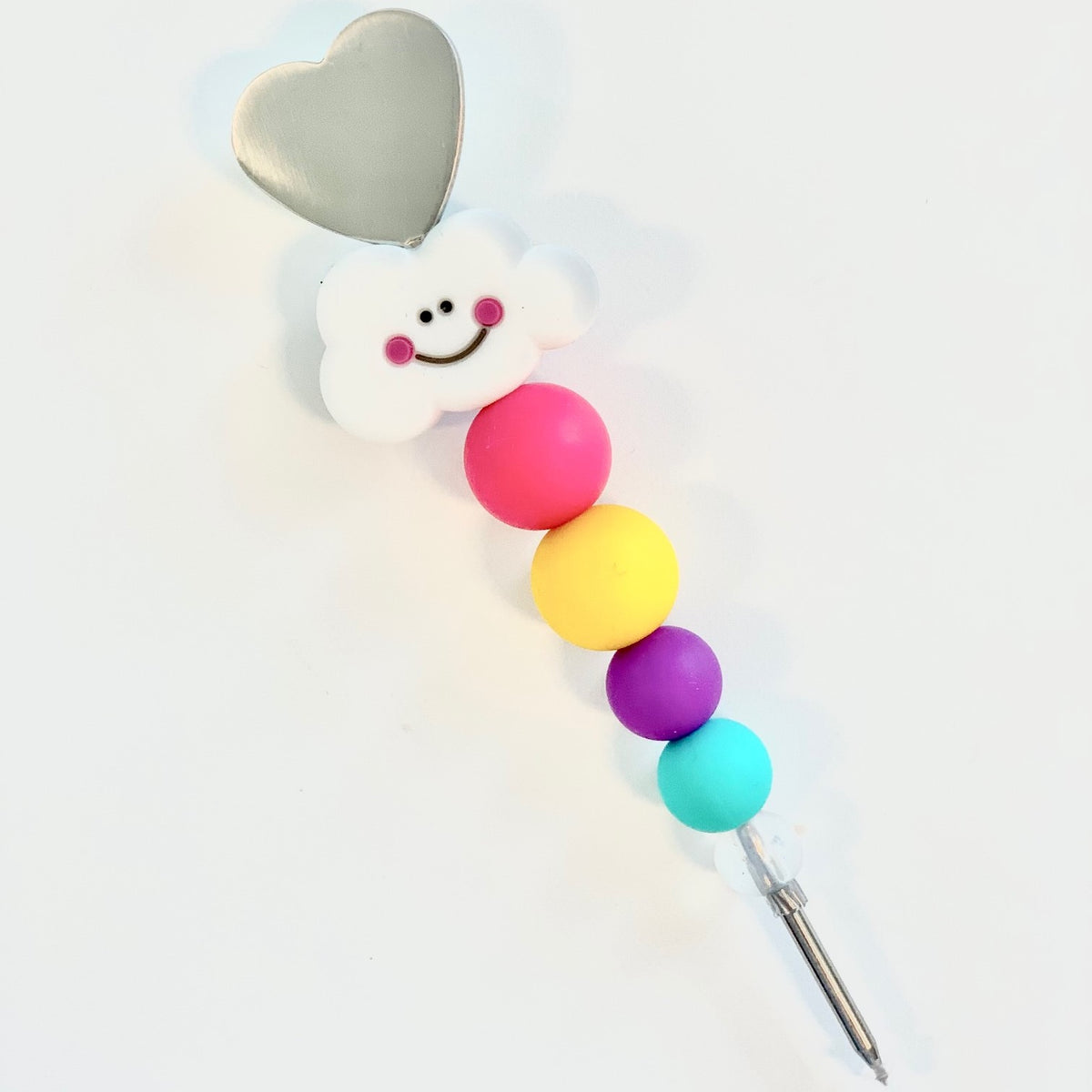 A cheerful shine bright cookie scribe magnet shaped like a cloud with a metallic heart and colorful silicone beads