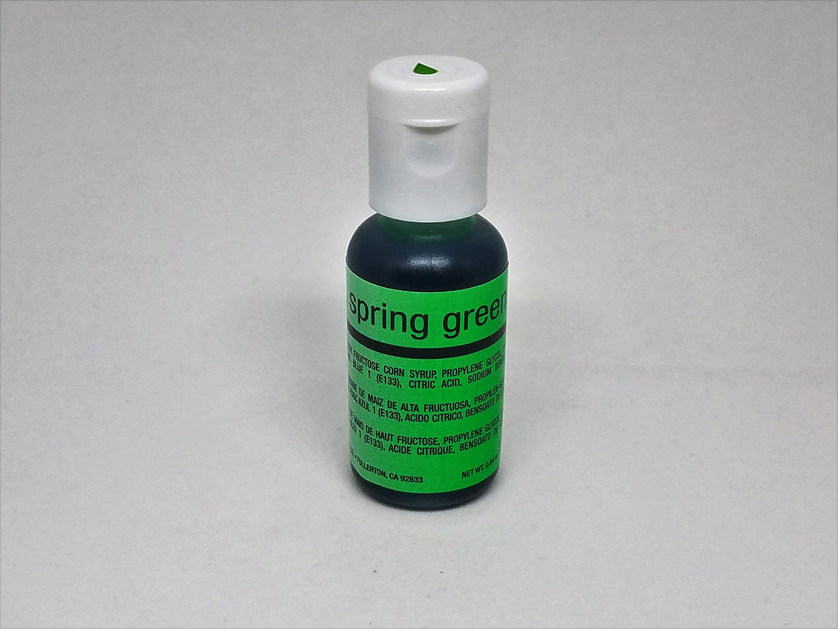 A small .64oz bottle of chefmaster spring green airbrush color with dark green liquid and white flip-top cap
