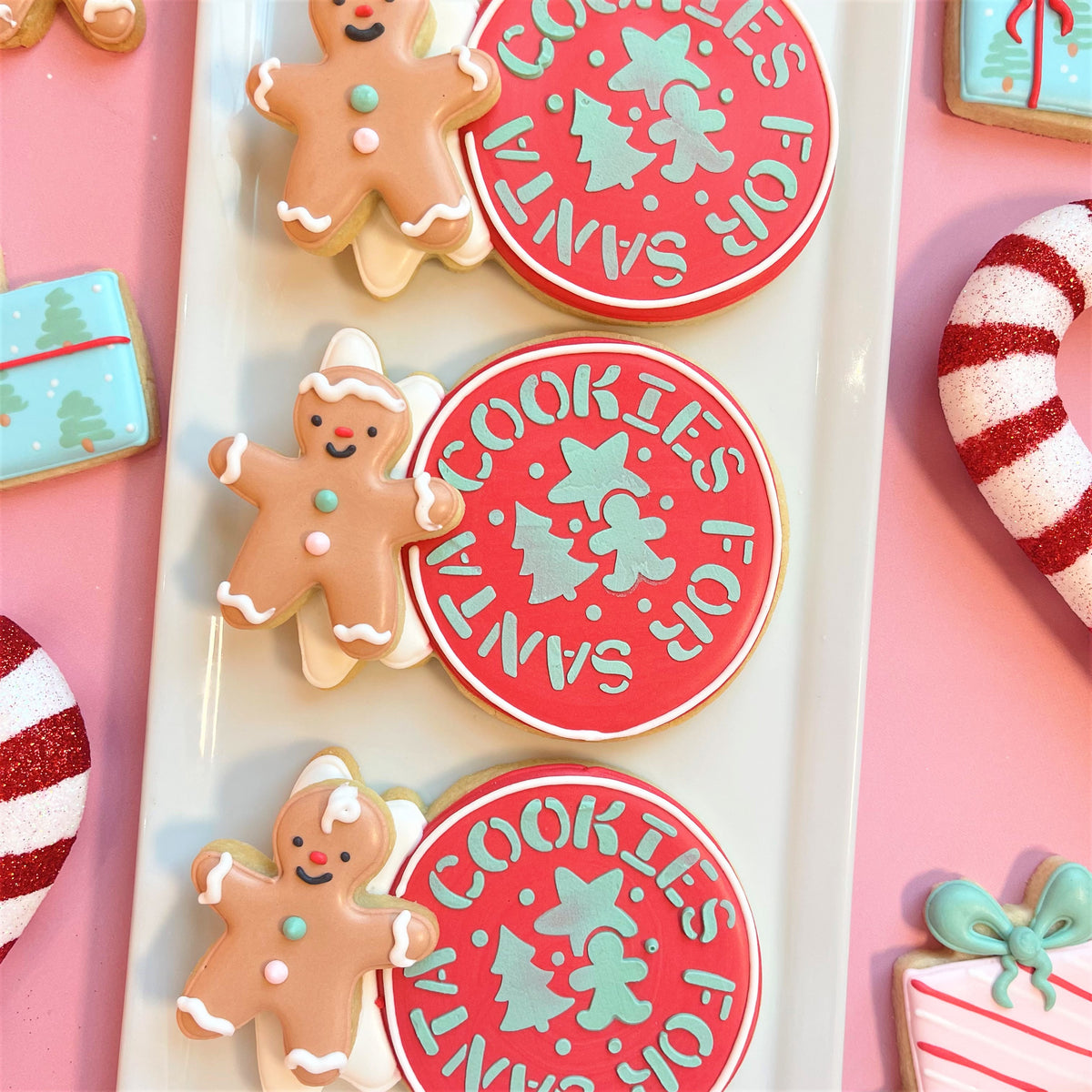 Gingerbread man cookies with white icing and colorful candy decorations in holiday stencils collection.