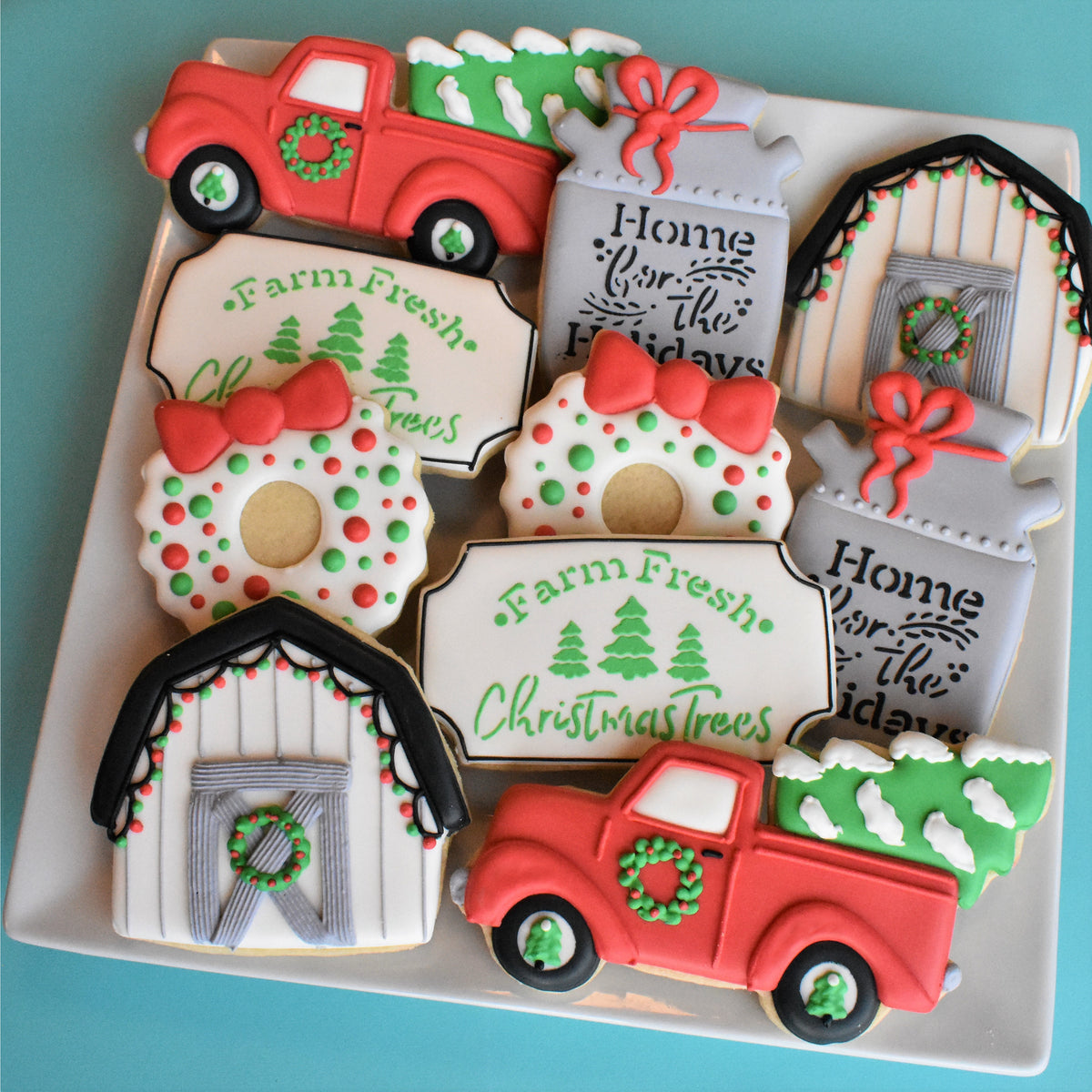 Red vintage truck-shaped sugar cookies with green wreaths and white-trimmed beds from farmhouse kit collection