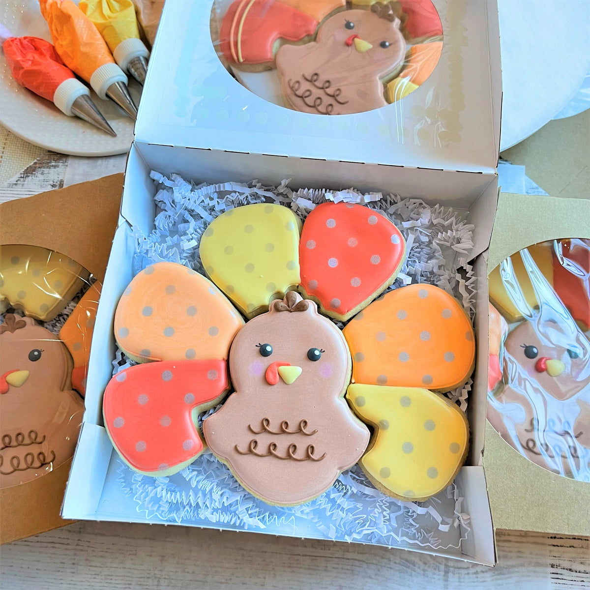 A charming turkey-shaped sugar cookie with pinkish-brown body and colorful polka-dotted feather cookies thanksgiving cutters