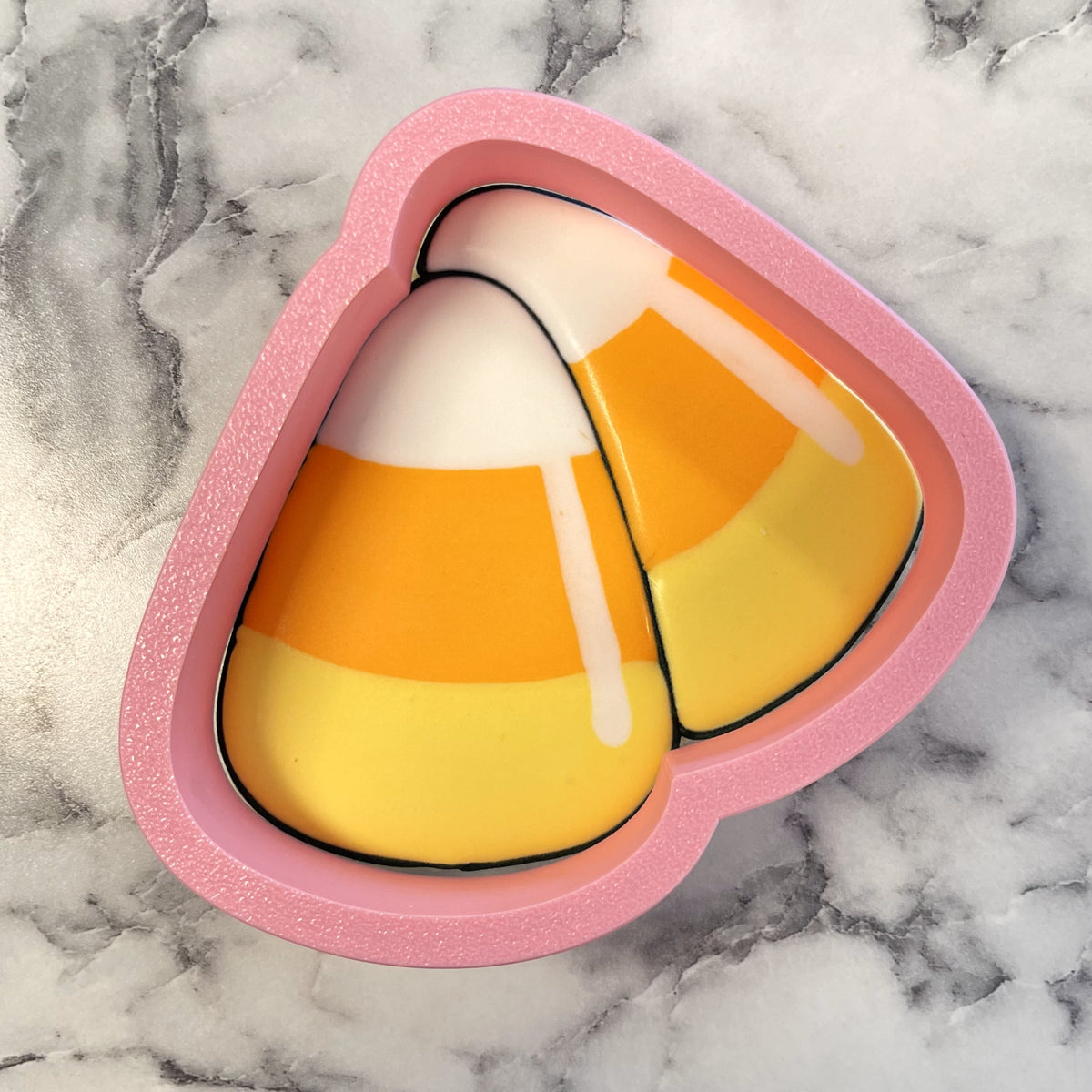 Pink glittery candy corn cluster flour box club cookie cutter with glossy layered orange and white design